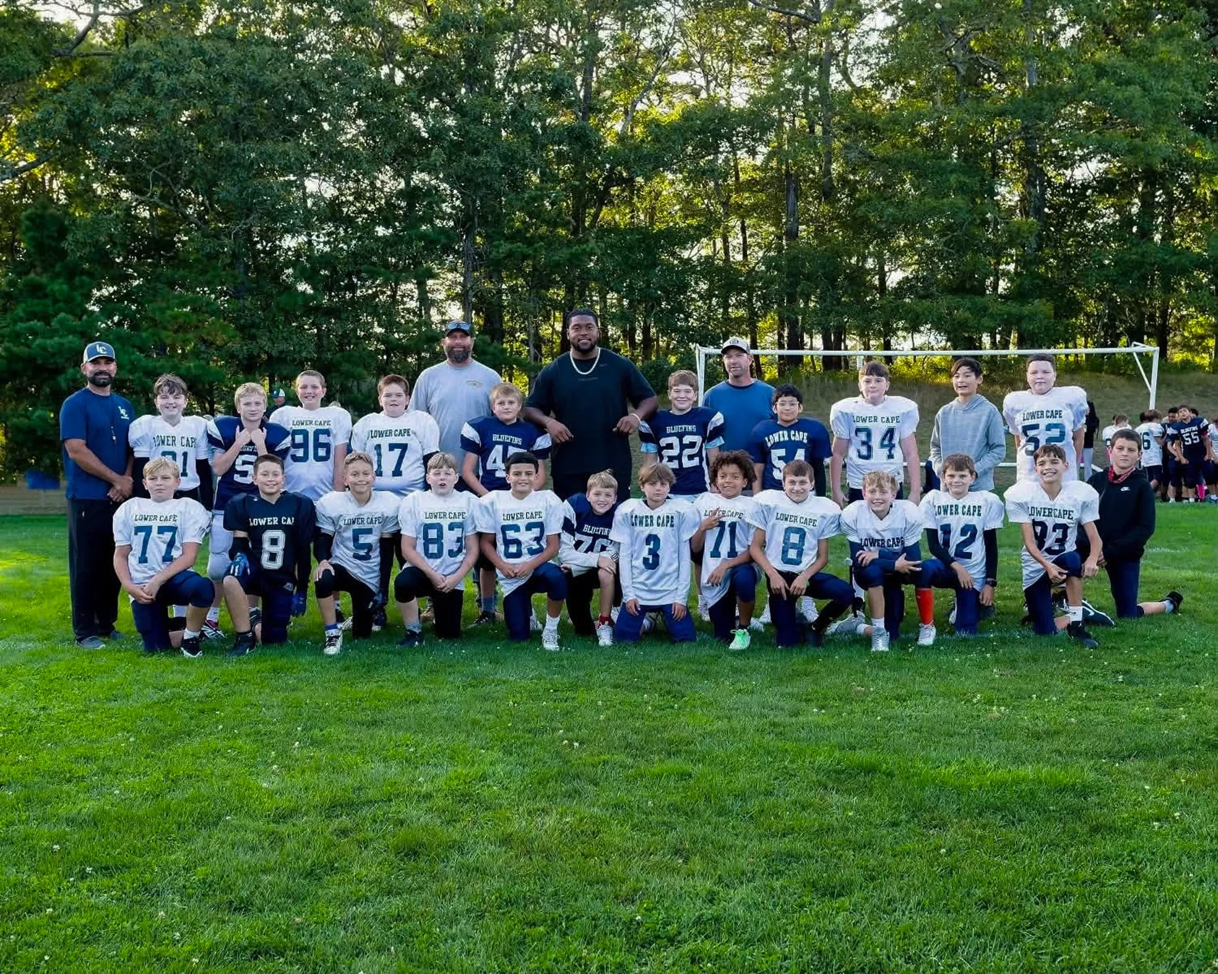The full Lower Cape Bluefins squad and coaching staff lined up on the field for a team photo